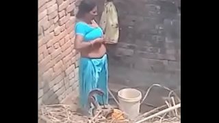 My Neighbour aunty Bathing showing her big boobs.